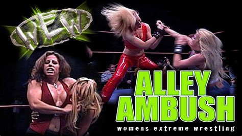 The two of them are struggling. . Womens extreme wrestling